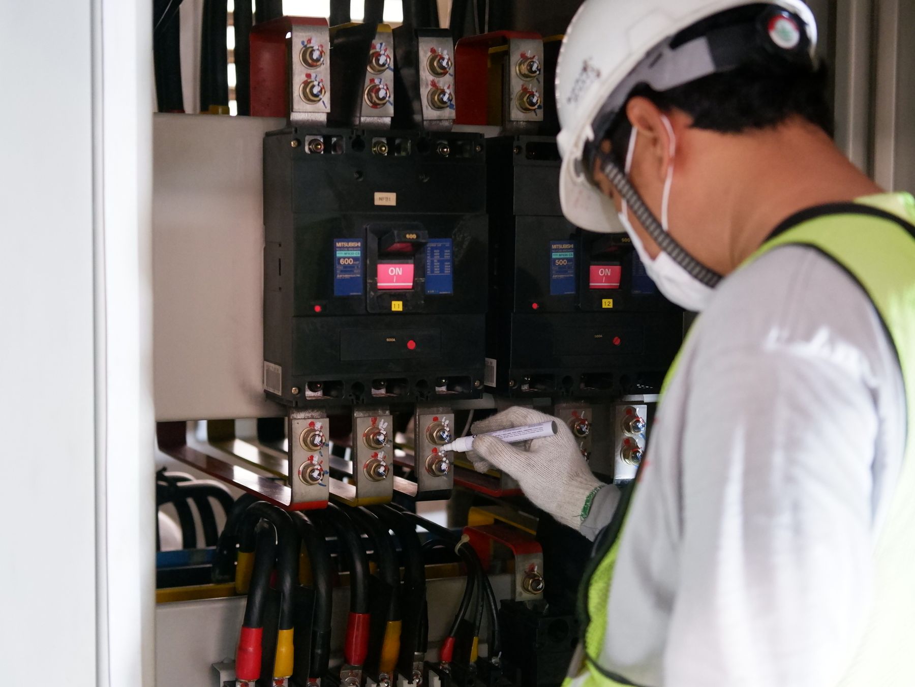 Electrician working on a light fitting